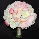 Mix of large and small pink and cream peonies and light pink ranunculus